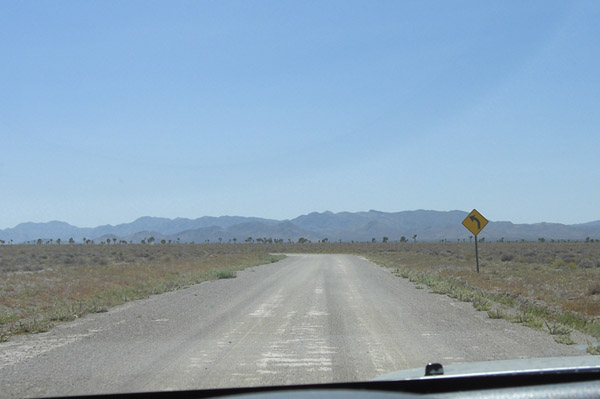 Driving 1 mile before our road goes to the left and faces another road crossing it. Turning right on that road. It is called Groom Lake Rd.