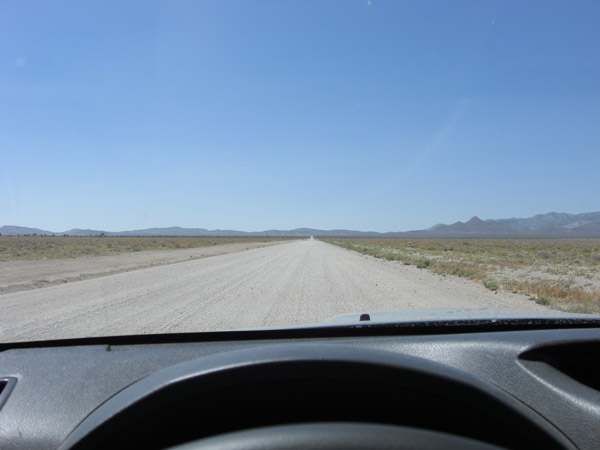 Keep on driving on Groom Lake Rd. It is approximately 8 1/2 miles to the entry to the base. Important: there is no gate, you can easily cross to forbidden territory if you don't pay attention.